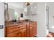 Bathroom features double sink vanity with updated fixtures and cabinetry at 7845 W Hillside Dr, Columbus, IN 47201
