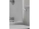 Close-up of the shower fixtures and toilet in the bathroom at 7845 W Hillside Dr, Columbus, IN 47201