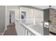 Hallway with neutral paint leads to bathrooms and bedrooms at 7845 W Hillside Dr, Columbus, IN 47201