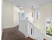Upstairs hallway with decorative lighting at 7845 W Hillside Dr, Columbus, IN 47201