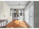 Spacious living room with a stone fireplace, hardwood floors, and large windows at 7845 W Hillside Dr, Columbus, IN 47201