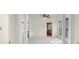 Open-concept living room with archways, neutral colors, and a view into the kitchen at 7845 W Hillside Dr, Columbus, IN 47201