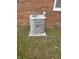 Exterior shot of an air conditioning unit sitting on a concrete slab at 805 Stewart Rd, Anderson, IN 46012