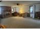 Finished basement with brick fireplace, neutral carpet, and traditional furniture at 805 Stewart Rd, Anderson, IN 46012