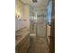 Bathroom featuring updated shower, vanity with sink, tile flooring, and natural light at 805 Stewart Rd, Anderson, IN 46012