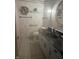 Cozy bathroom featuring tiled floors and a vanity with a dark countertop at 805 Stewart Rd, Anderson, IN 46012