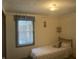 Bedroom with natural light from window and view of outdoor seating area, features closet for storage at 805 Stewart Rd, Anderson, IN 46012