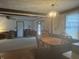 Dining room with wood table, decorative chandelier, and neutral colored walls at 805 Stewart Rd, Anderson, IN 46012