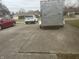 Wide driveway with parked vehicles including a trailer at 805 Stewart Rd, Anderson, IN 46012