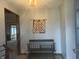 Inviting entryway with tiled floors, bench seating, and chandelier lighting at 805 Stewart Rd, Anderson, IN 46012