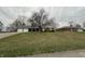 Charming single-story home featuring an attached garage and well-maintained lawn at 805 Stewart Rd, Anderson, IN 46012