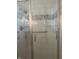 Newly tiled shower with glass door and grab bar at 805 Stewart Rd, Anderson, IN 46012