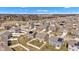 Aerial view of a residential neighborhood featuring tidy lawns and various home exteriors on a sunny day at 8153 Fivespot Ln, Plainfield, IN 46168