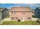 Large backyard with a sliding glass door leading to a patio at 8153 Fivespot Ln, Plainfield, IN 46168