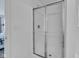 Clean bathroom featuring a glass-enclosed shower with white tile surround at 8153 Fivespot Ln, Plainfield, IN 46168