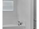 Bathroom with soaking tub, chrome faucet, and window with horizontal blinds at 8153 Fivespot Ln, Plainfield, IN 46168