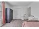 Cozy bedroom featuring gray carpet, white walls, double-door closet, and open doorway at 8153 Fivespot Ln, Plainfield, IN 46168