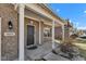 Welcoming front entrance features brick facade, stylish door, and covered porch at 8153 Fivespot Ln, Plainfield, IN 46168