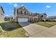 Charming two-story home with a long driveway, front yard and traditional architectural design at 8153 Fivespot Ln, Plainfield, IN 46168