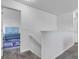 Upstairs hallway leads to carpeted bedrooms with neutral walls and white trim at 8153 Fivespot Ln, Plainfield, IN 46168
