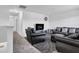 Cozy living room with dark leather furniture and carpeted floor at 8153 Fivespot Ln, Plainfield, IN 46168