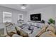 Bright living room featuring plush sofa, modern lighting, and stylish decor at 8153 Fivespot Ln, Plainfield, IN 46168