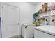 Pantry features laminate flooring, wire shelving, and chest freezers near a white door at 8153 Fivespot Ln, Plainfield, IN 46168