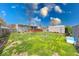 Large backyard with a wooden deck, fire pit, and storage shed at 868 Glendale Dr, Franklin, IN 46131
