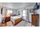 Cozy bedroom with hardwood floors, natural light, and a TV at 868 Glendale Dr, Franklin, IN 46131