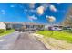 Inviting single-story home with a long driveway and well-maintained lawn at 868 Glendale Dr, Franklin, IN 46131
