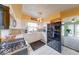 The kitchen is well lit and features stainless steel appliances, white cabinets, and tile floors at 868 Glendale Dr, Franklin, IN 46131