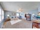 Cozy living room with carpet, a ceiling fan, and lots of natural light from large windows at 868 Glendale Dr, Franklin, IN 46131