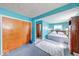 Open main bedroom features blue walls, natural light and doorway to en-suite bathroom at 868 Glendale Dr, Franklin, IN 46131