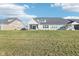Large backyard with a view of neighboring houses at 887 Tuxedo Dr, Westfield, IN 46074