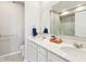 Bathroom featuring dual sinks, a large mirror, and blue towels for a clean, modern look at 887 Tuxedo Dr, Westfield, IN 46074