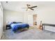 Well-lit bedroom with a ceiling fan, desk area, and light blue quilted bedding at 887 Tuxedo Dr, Westfield, IN 46074