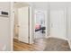 Bright entryway featuring wood floors, with views of a bedroom and bathroom at 887 Tuxedo Dr, Westfield, IN 46074
