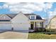 Charming exterior view of a single-Gathering home with a well-manicured lawn and attached two-car garage at 887 Tuxedo Dr, Westfield, IN 46074
