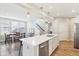 Bright, open kitchen with an island sink, and view of the dining and stairwell at 887 Tuxedo Dr, Westfield, IN 46074