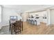 Open-concept kitchen and dining area featuring an island with seating and hardwood flooring at 887 Tuxedo Dr, Westfield, IN 46074