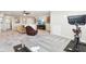 A bright living space with comfortable seating, workout equipment, and a large TV at 887 Tuxedo Dr, Westfield, IN 46074