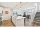 Spacious living room with lots of windows with hardwood flooring, open to the kitchen and staircase at 887 Tuxedo Dr, Westfield, IN 46074
