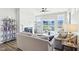 Bright living room featuring a fireplace, large windows, and comfortable seating at 887 Tuxedo Dr, Westfield, IN 46074