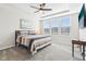 Primary bedroom with a tray ceiling, carpeted floor, and plenty of natural light at 887 Tuxedo Dr, Westfield, IN 46074