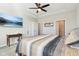 Large Primary bedroom with tray ceiling, wall-mounted TV, and multiple closets at 887 Tuxedo Dr, Westfield, IN 46074