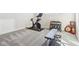 Bright workout area featuring a Peloton bike and dumbbell rack for your fitness needs at 887 Tuxedo Dr, Westfield, IN 46074