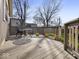 Outdoor deck features a small table setting, perfect for enjoying a morning coffee at 935 E Mckay Rd, Shelbyville, IN 46176