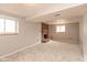 Spacious living room features a cozy brick fireplace and neutral carpeting for warmth and comfort at 9462 Bent Brook Dr, Indianapolis, IN 46250