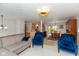 Open-concept living space with modern lighting, comfortable seating, and a dining area at 9462 Bent Brook Dr, Indianapolis, IN 46250