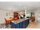Bright living space with a kitchen island, a dining area, and a cozy living room at 9462 Bent Brook Dr, Indianapolis, IN 46250
